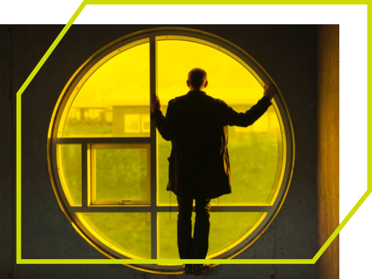 Man silhouette by yellow circleshaped window